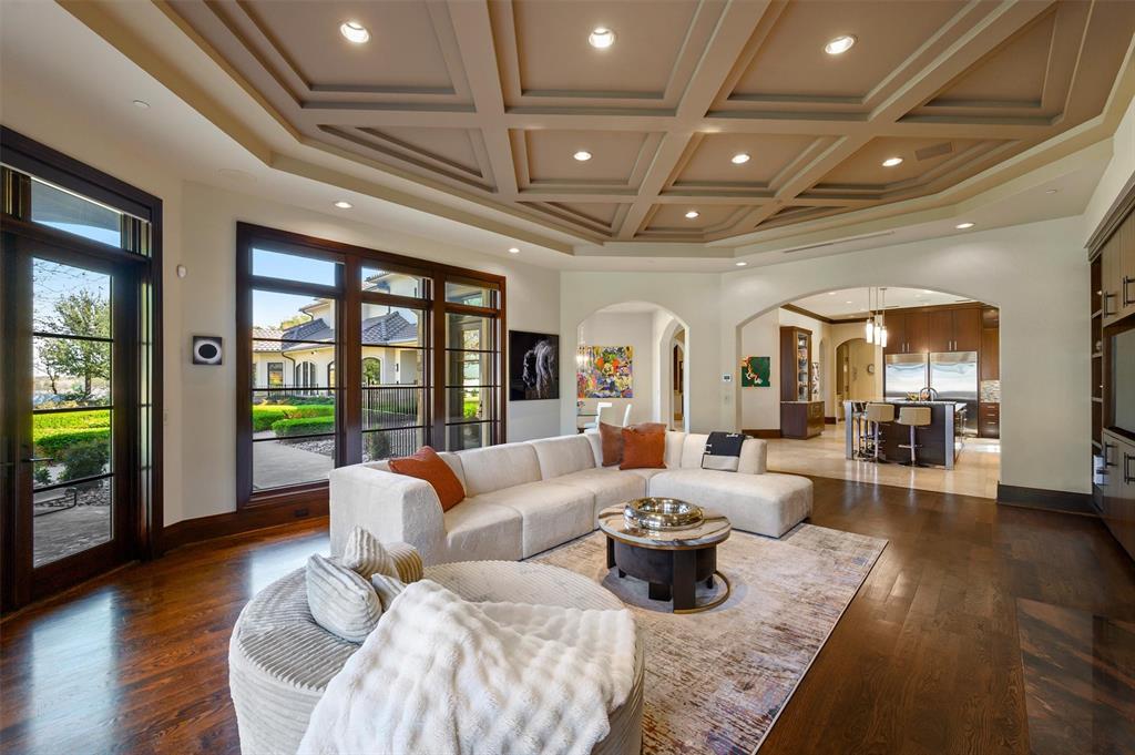 940 Dove Road Southlake, TX 76092 - Photo 13 of 34 a living room with furniture floor to ceiling window and wooden floor