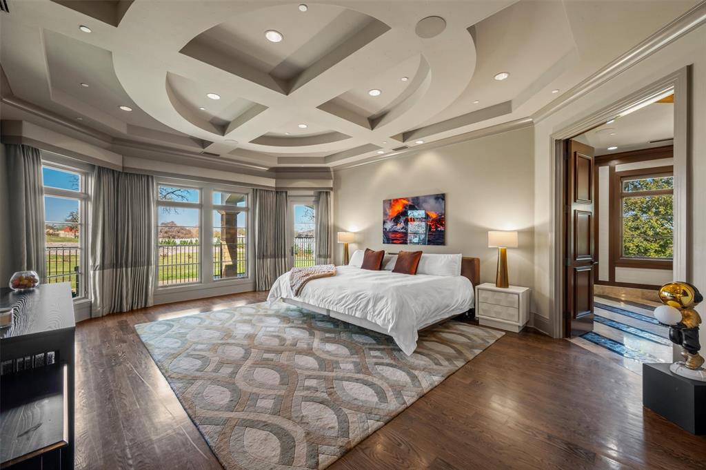 940 Dove Road Southlake, TX 76092 - Photo 16 of 34 a bedroom with a large bed and a large window