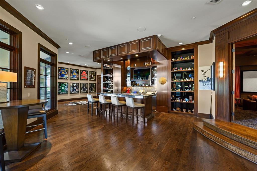 940 Dove Road Southlake, TX 76092 - Photo 19 of 34 a view of a dining room with furniture and wooden floor
