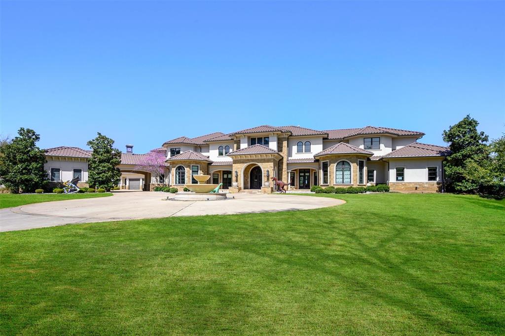 940 Dove Road Southlake, TX 76092 - Photo 2 of 34 a front view of a house with swimming pool having outdoor seating