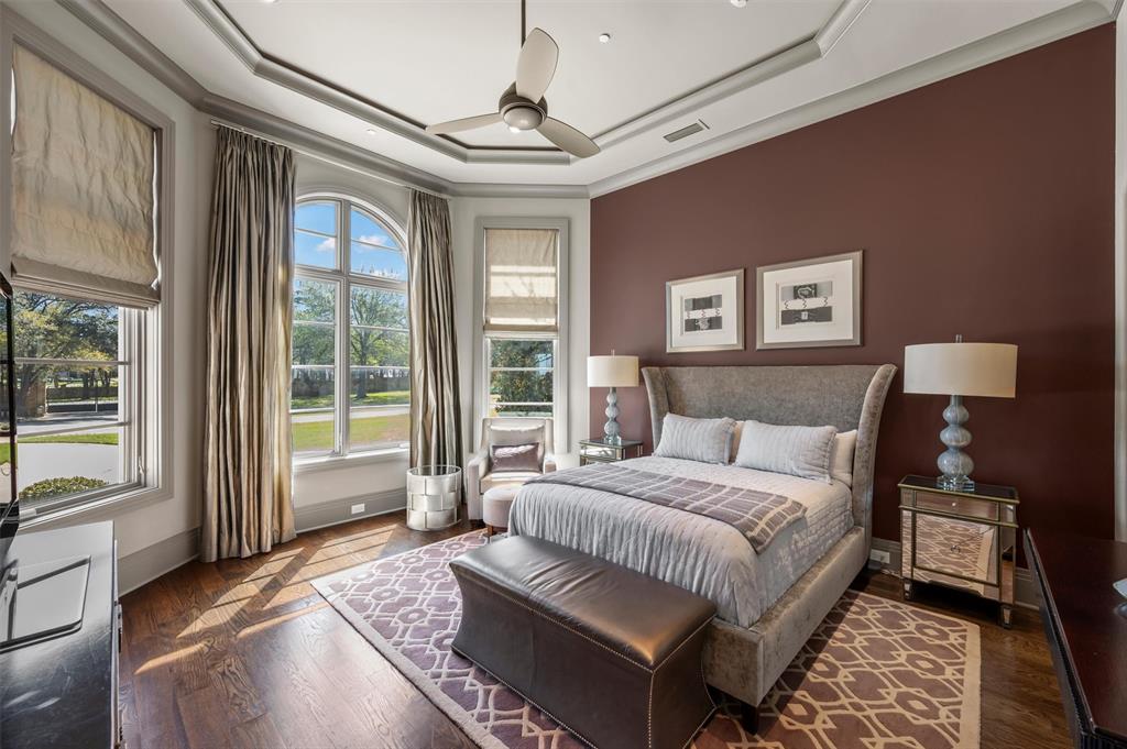 940 Dove Road Southlake, TX 76092 - Photo 24 of 34 a bedroom with a large bed and a large window