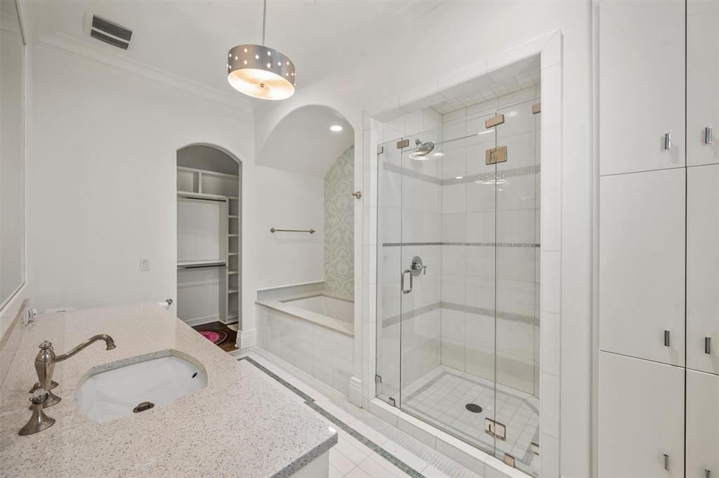 940 Dove Road Southlake, TX 76092 - Photo 28 of 34 a bathroom with a shower sink and mirror