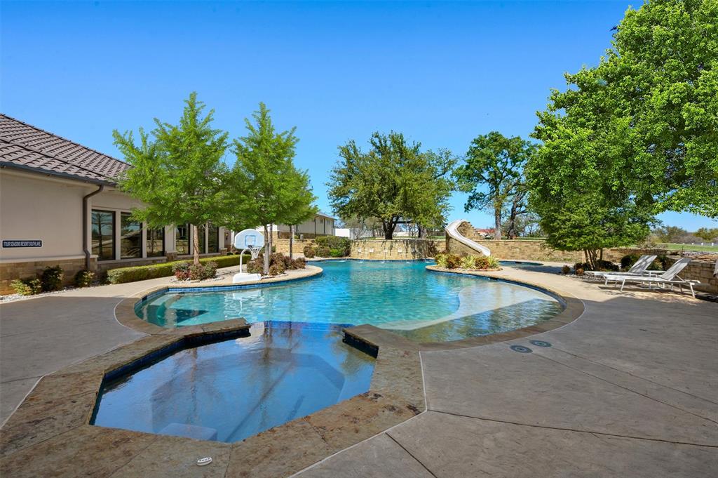 940 Dove Road Southlake, TX 76092 - Photo 30 of 34 a view of a swimming pool with a patio