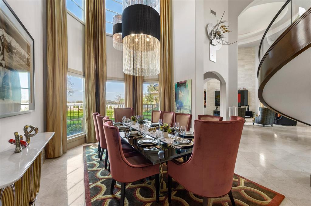 940 Dove Road Southlake, TX 76092 - Photo 6 of 34 a dining room with furniture a chandelier and wooden floor