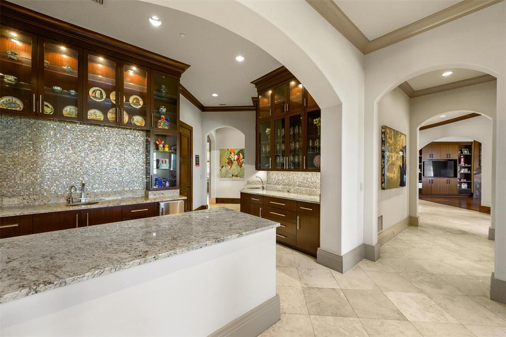 940 Dove Road Southlake, TX 76092 - Photo 7 of 34 a large living room with stainless steel appliances granite countertop furniture and a fireplace