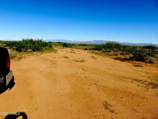 a view of a town with mountains in the background