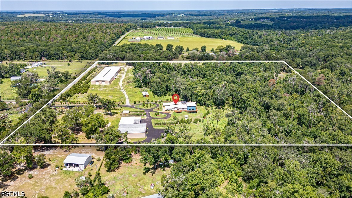 27255 Hickory Hill Road Brooksville, FL 34602 - Photo 3 of 50 an aerial view of residential houses with outdoor space