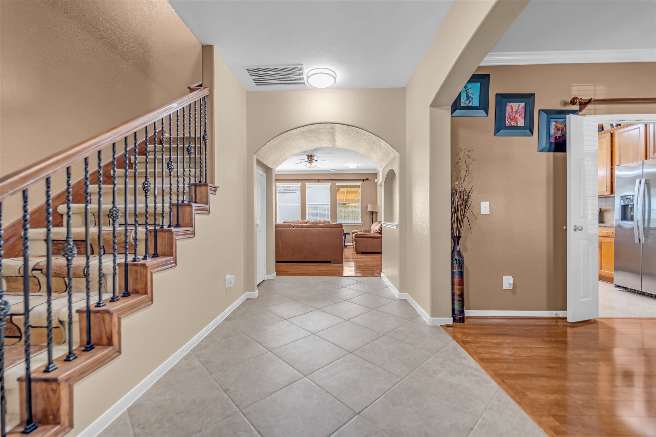 5406 Quarry Ridge Road Richmond, TX 77407 - Photo 5 of 36 Welcoming foyer with an elegant staircase, arched entryways, and open sightlines that create a bright, inviting flow throughout the home.