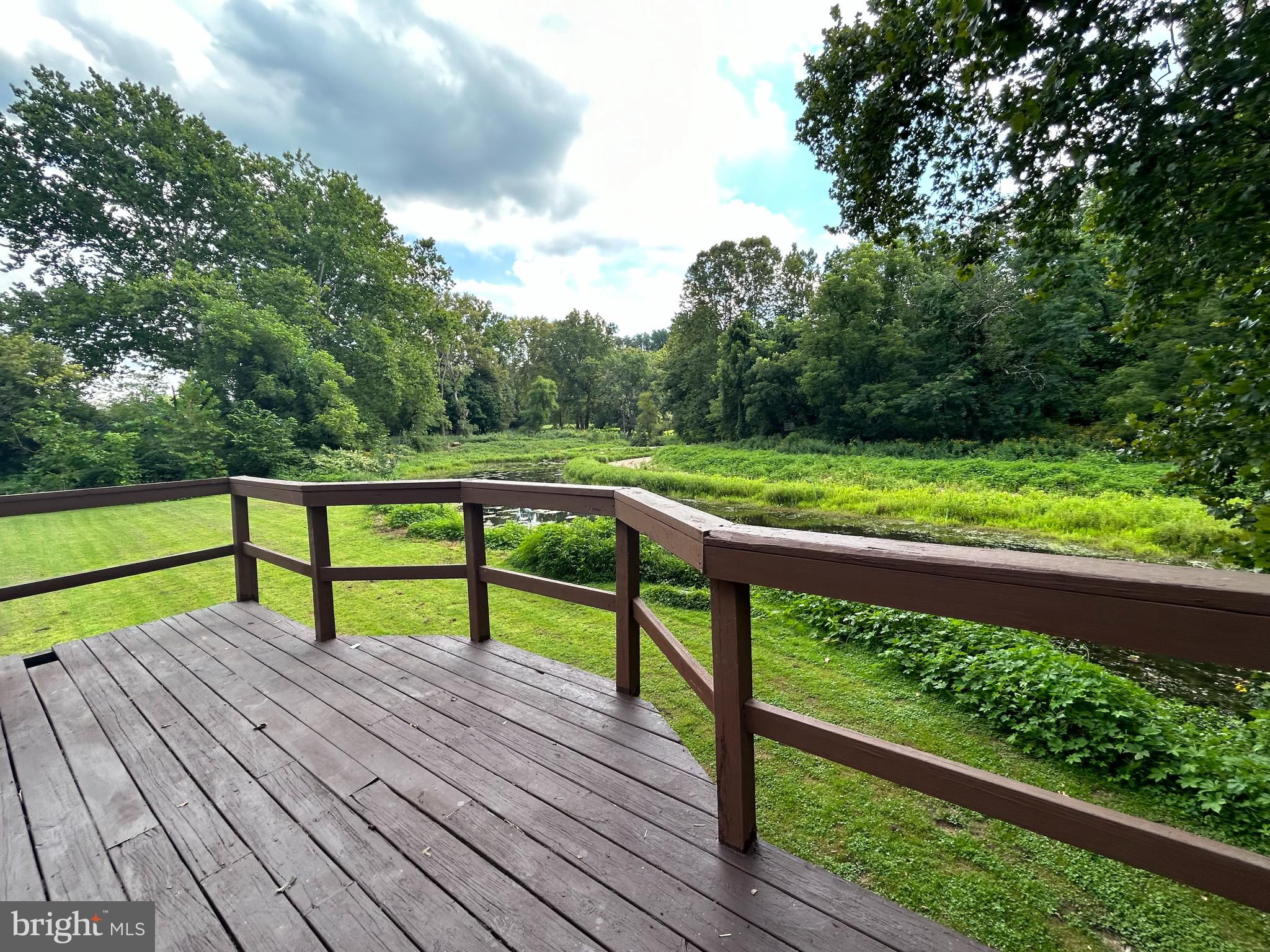 a view of a bench sitting on a wooden deck