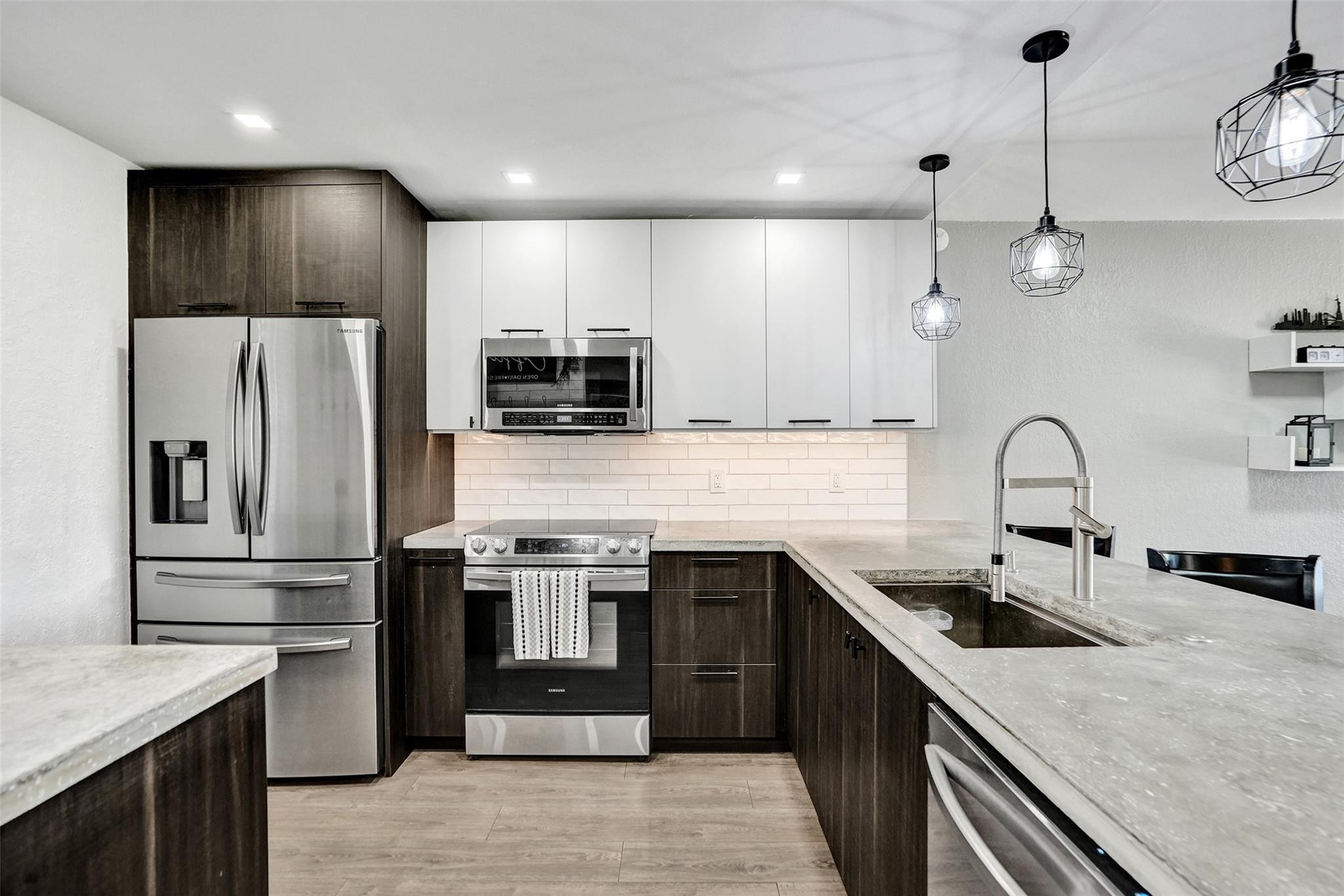 a kitchen with a sink a stove and refrigerator