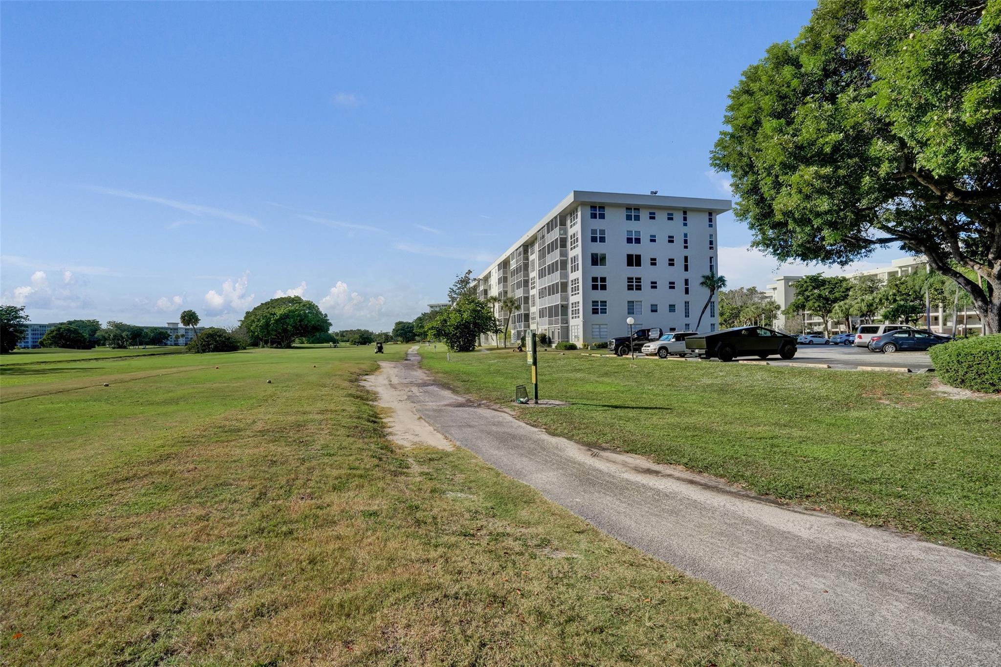 3001 South Course Drive, Unit 107 Pompano Beach, FL 33069 - Photo 11 of 47 a view of a house with a yard