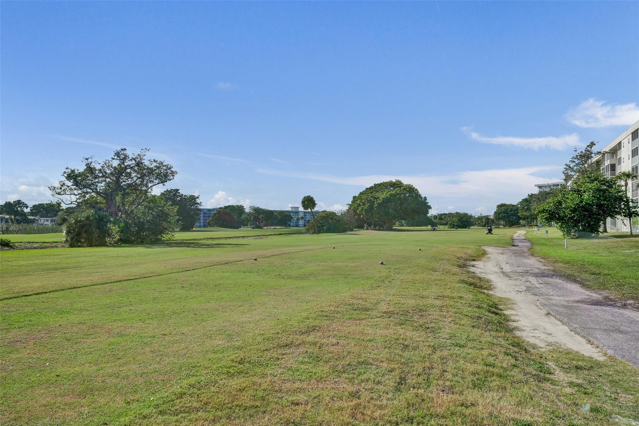 3001 South Course Drive, Unit 107 Pompano Beach, FL 33069 - Photo 12 of 47 a view of a field with an trees