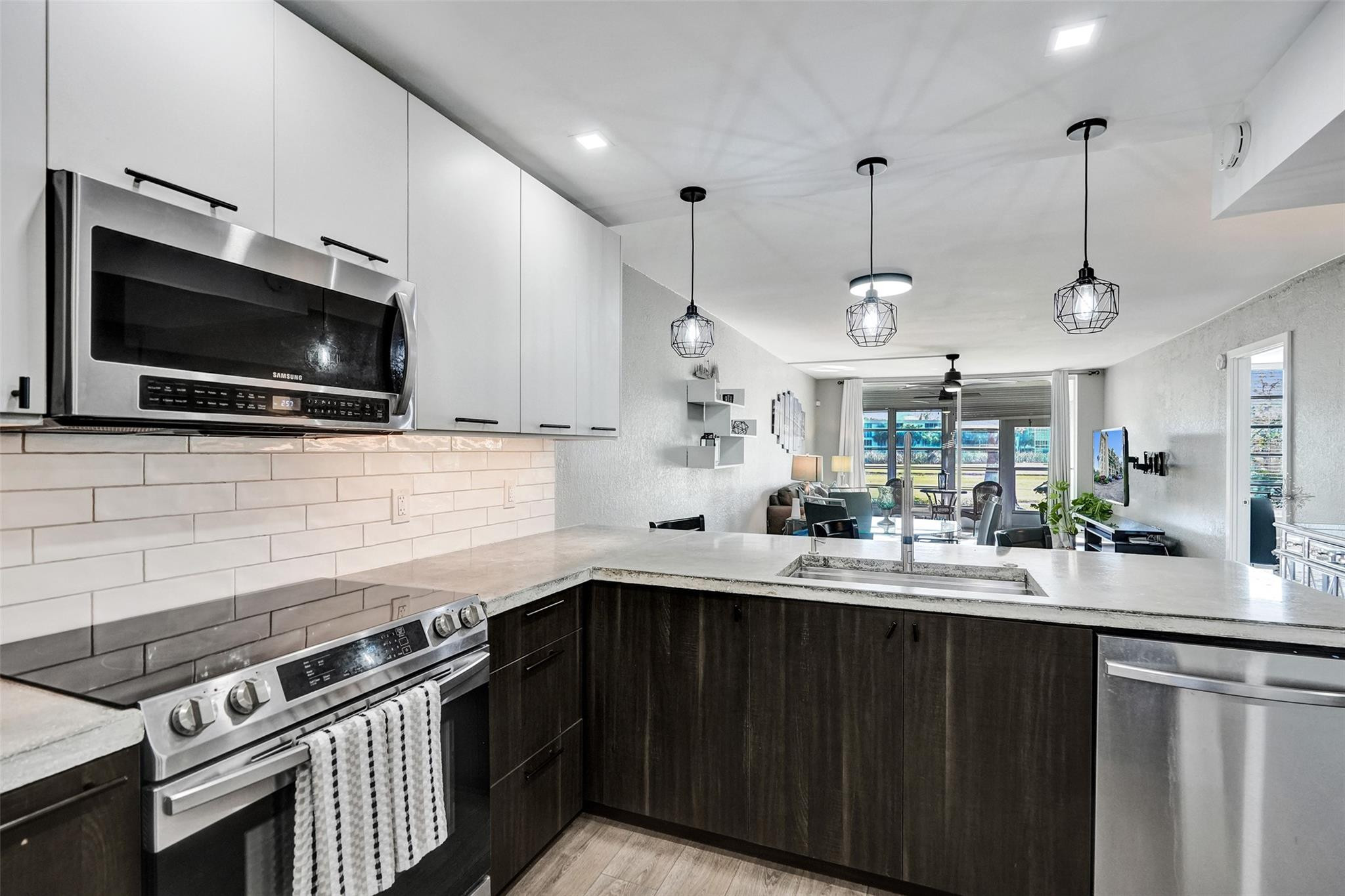 3001 South Course Drive, Unit 107 Pompano Beach, FL 33069 - Photo 16 of 47 a kitchen with a sink a stove and oven