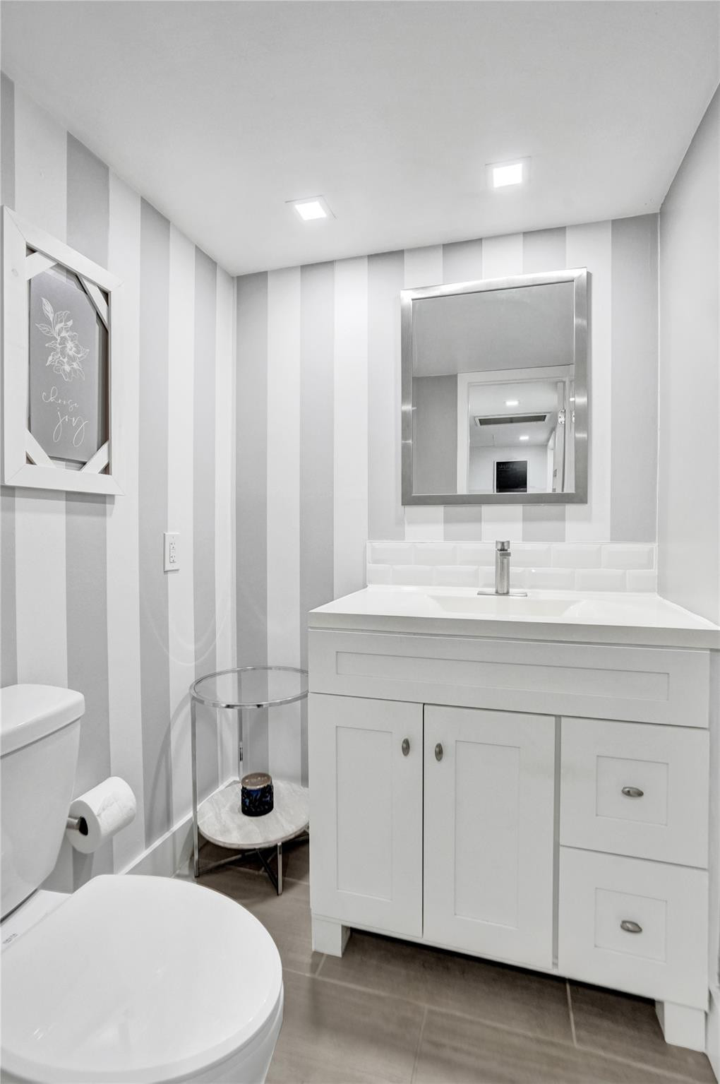 3001 South Course Drive, Unit 107 Pompano Beach, FL 33069 - Photo 24 of 47 a bathroom with a double vanity sink and mirror