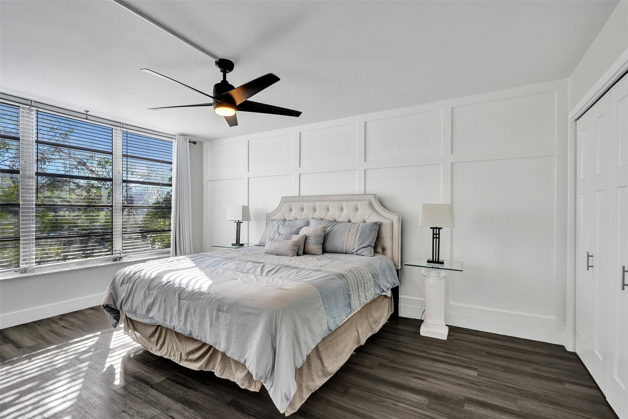 3001 South Course Drive, Unit 107 Pompano Beach, FL 33069 - Photo 25 of 47 a bedroom with a bed and a window