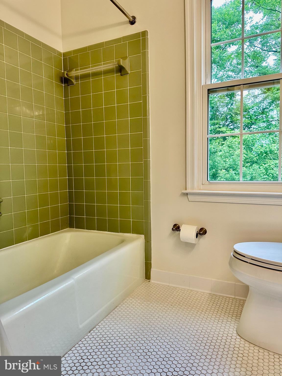 5230 Lonsdale Drive Springfield, VA 22151 - Photo 15 of 25 a white bath tub sitting next to a white toilet