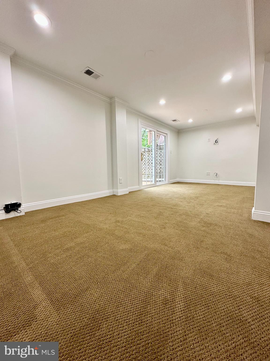 5230 Lonsdale Drive Springfield, VA 22151 - Photo 17 of 25 a view of an empty room with wooden floor and a window