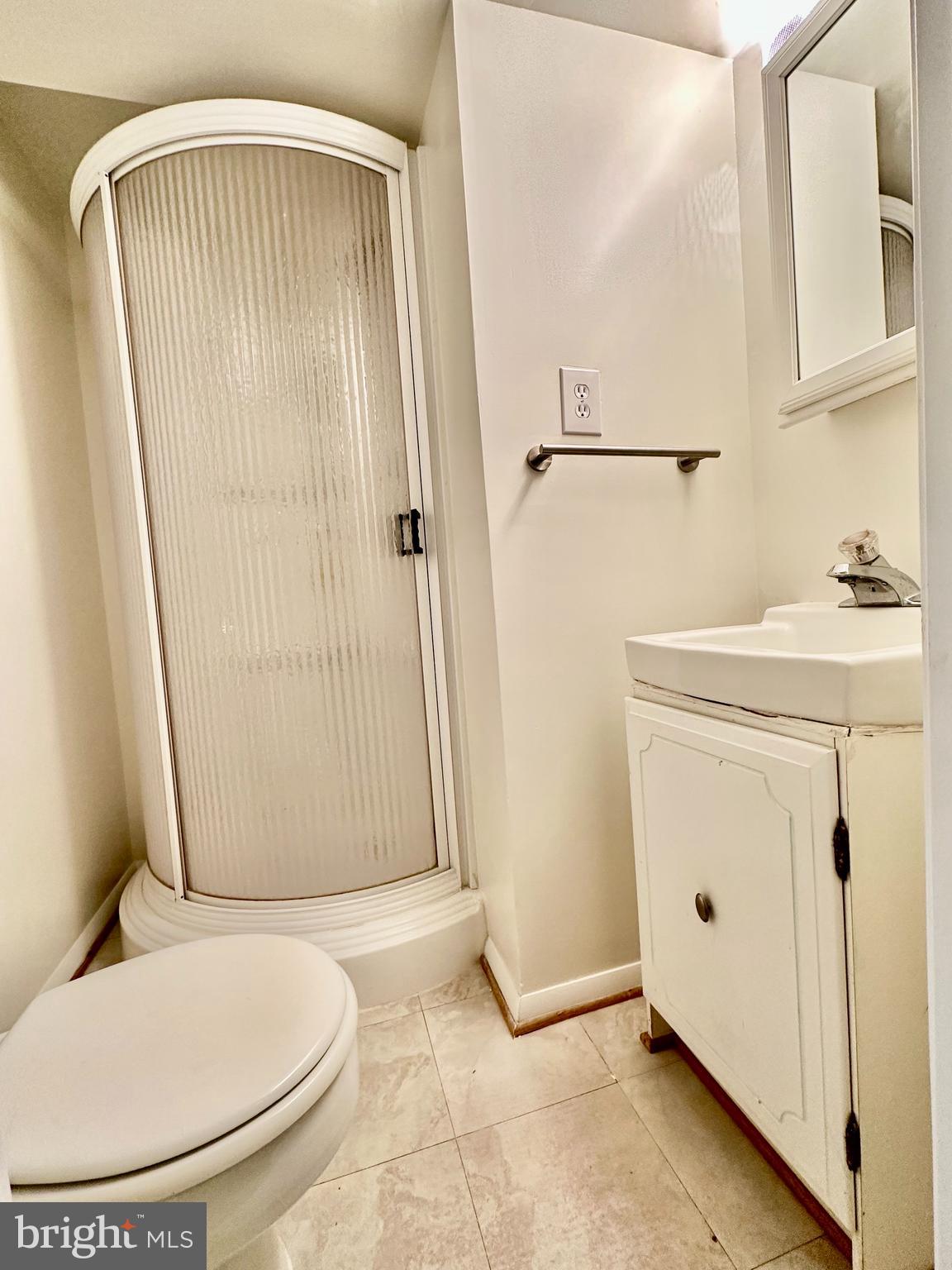 5230 Lonsdale Drive Springfield, VA 22151 - Photo 21 of 25 a bathroom with a sink a toilet and shower