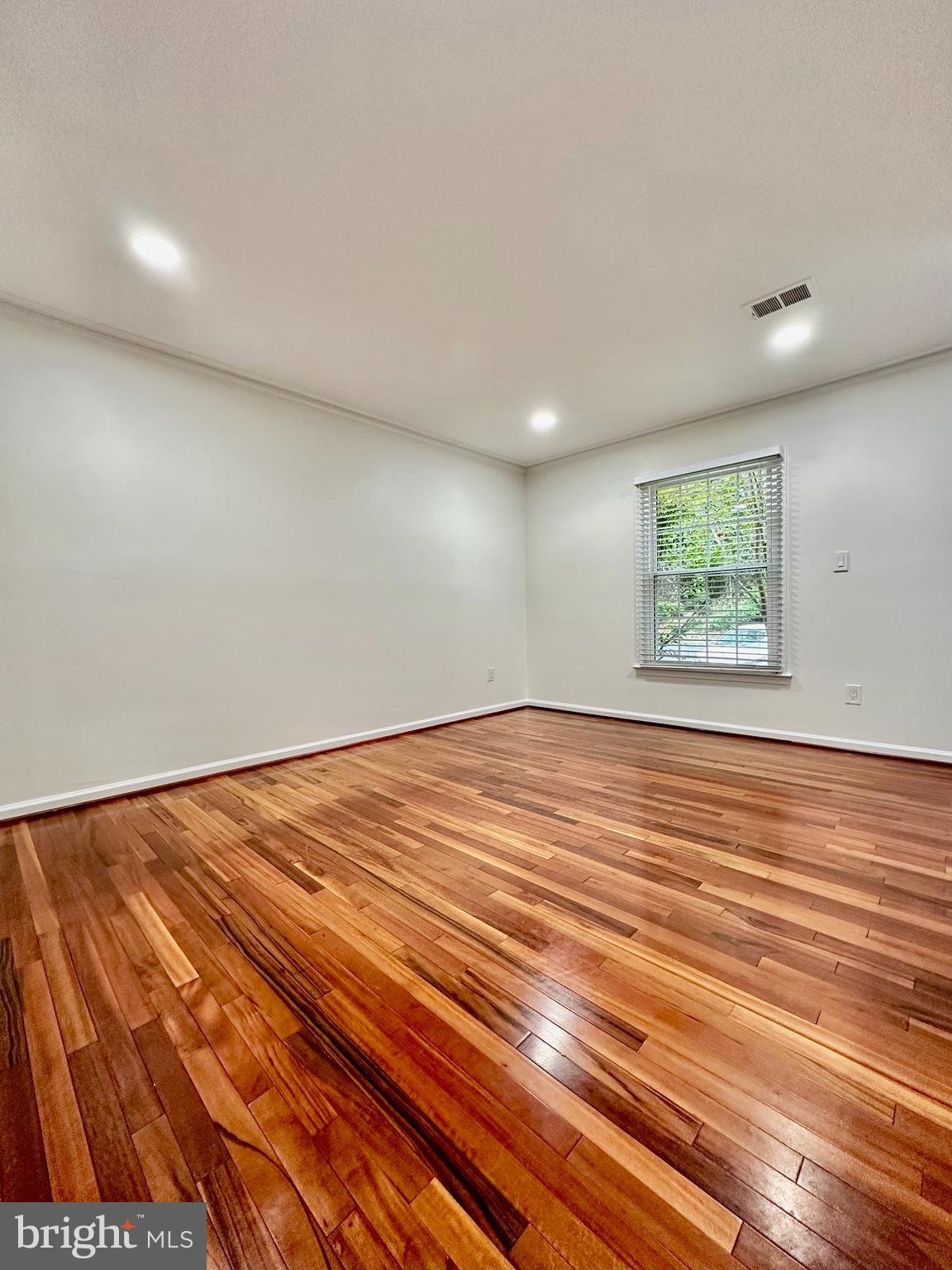 5230 Lonsdale Drive Springfield, VA 22151 - Photo 3 of 25 an empty room with wooden floor and window