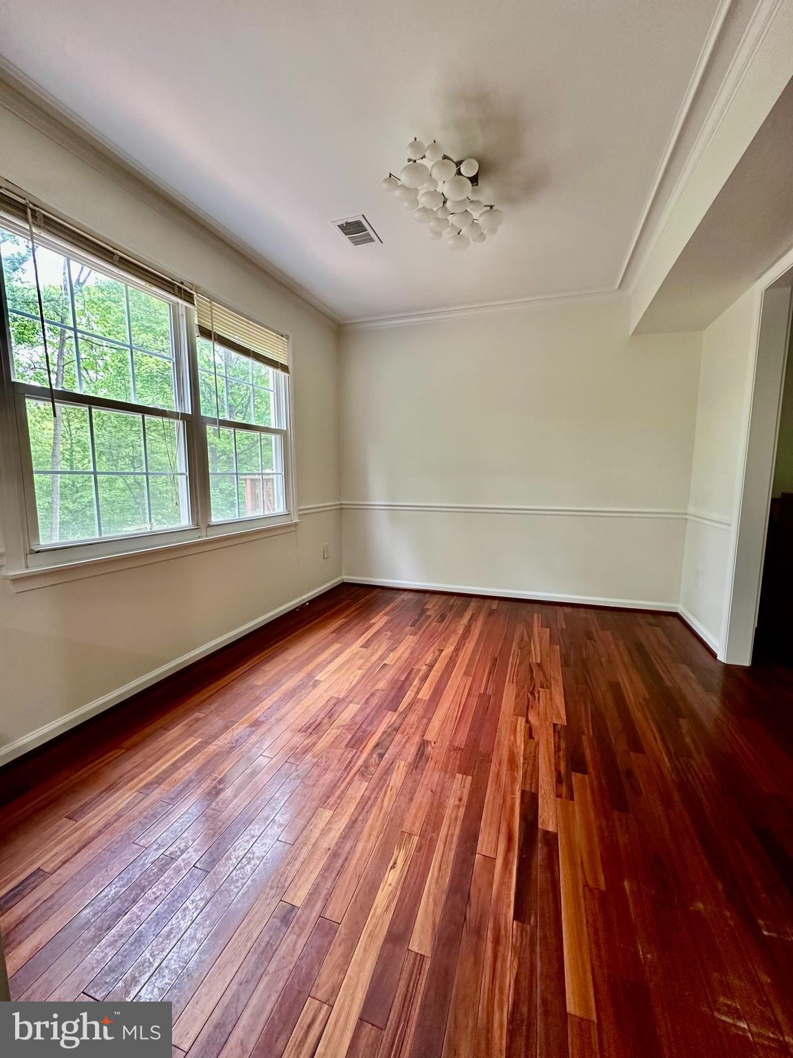 5230 Lonsdale Drive Springfield, VA 22151 - Photo 4 of 25 wooden floor in an empty room with a window