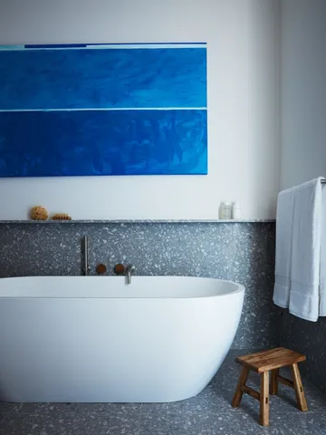 a white bath tub sitting in a bathroom