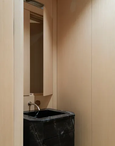 a close up of a mirror and a sink