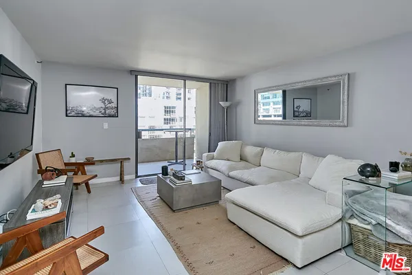 a living room with furniture and a window