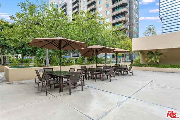 a patio with a patio table and chairs