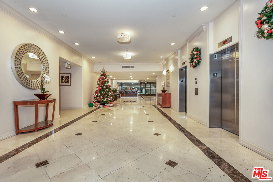 600 West 9th Street, Unit 805 Los Angeles, CA 90015 - Photo 27 of 28 a view of a living room and a chandelier