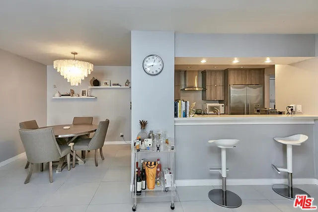 a kitchen with a table and chairs in it
