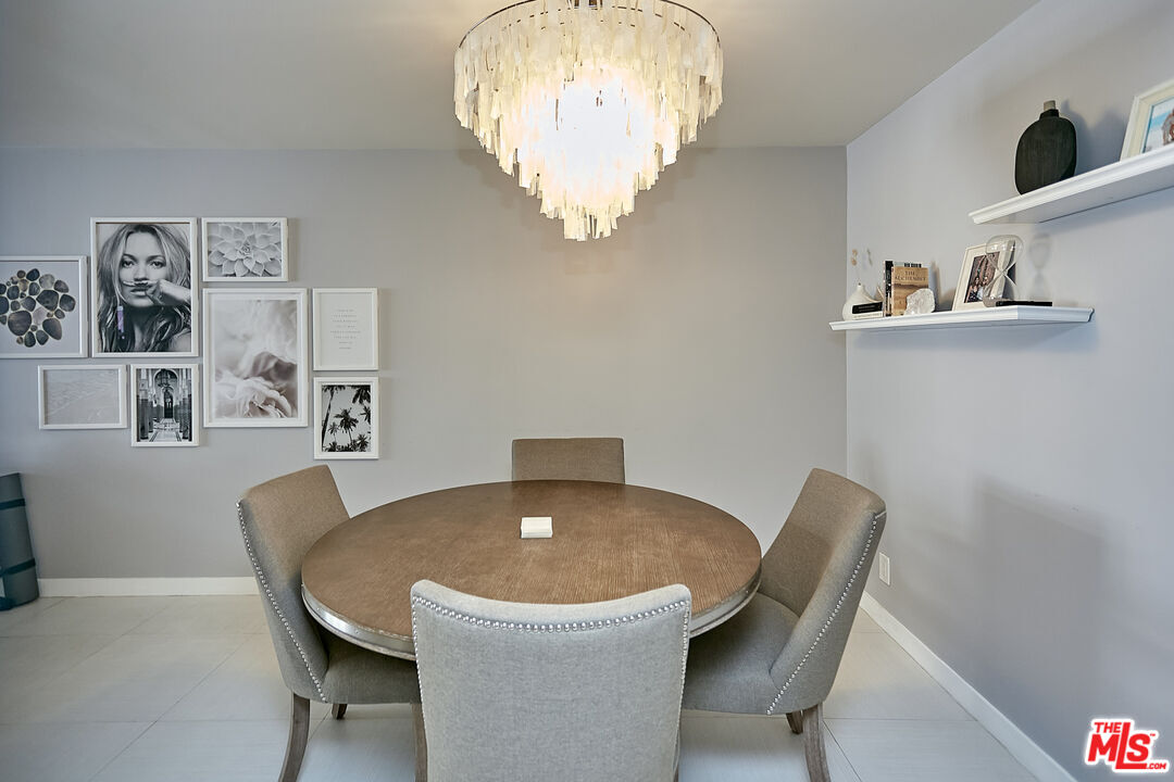 600 West 9th Street, Unit 805 Los Angeles, CA 90015 - Photo 7 of 28 a view of a dining room with furniture and wooden floor
