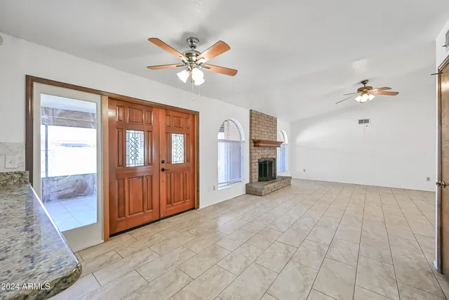 a view of an empty room with closet area