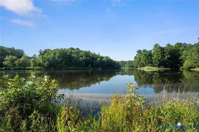 a view of a lake with a house in the background