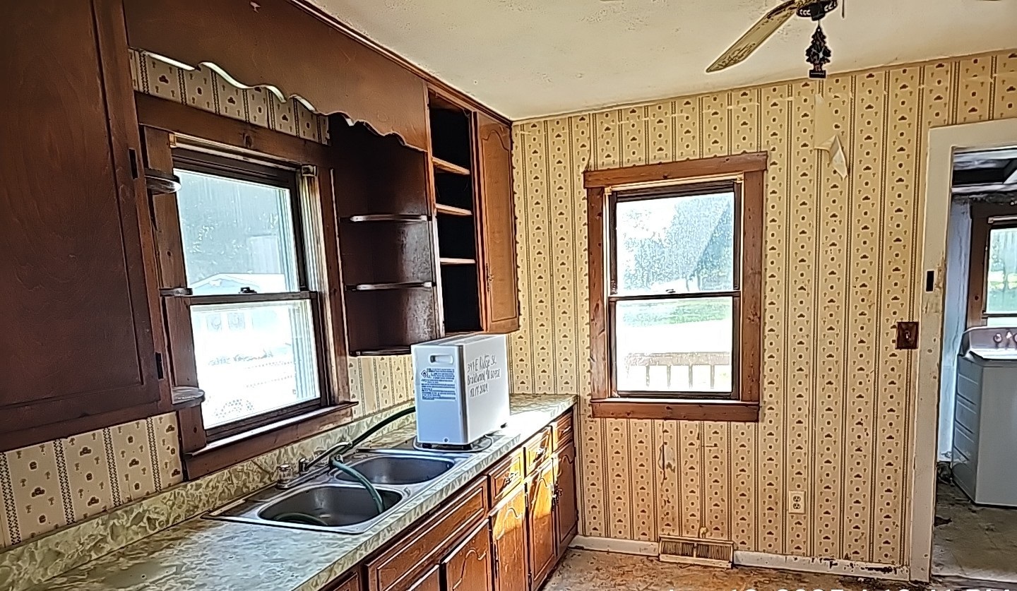 347 Ridge Street Braidwood, IL 60408 - Photo 7 of 19 a kitchen with a sink stove and refrigerator