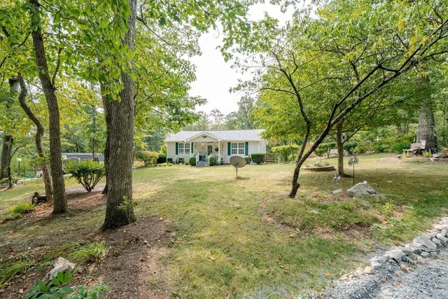 a swimming pool with a trees in the background
