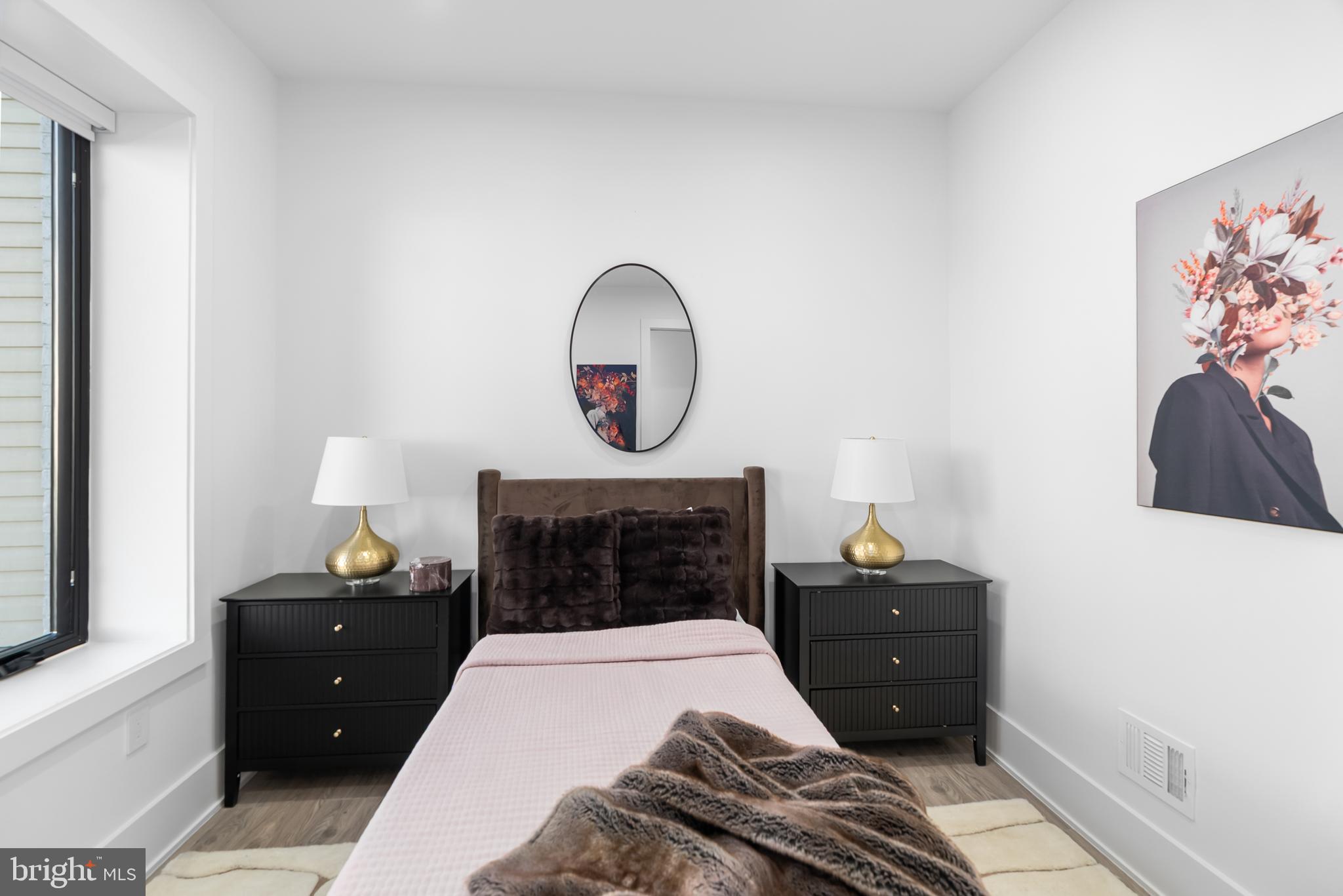 1140 Oates Street Northeast, Unit 101 Washington, DC 20002 - Photo 15 of 34 a bedroom with a bed and a closet