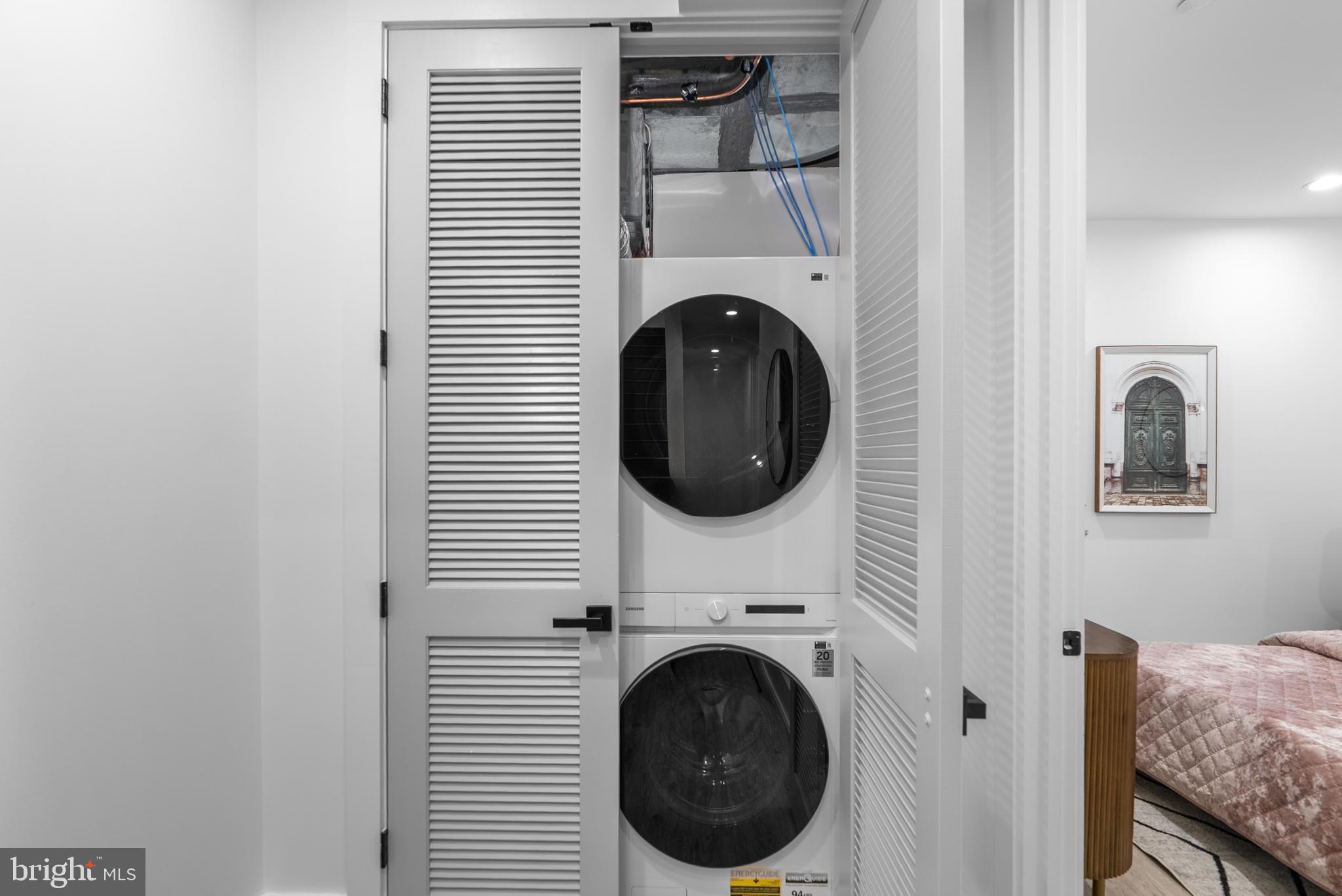 1140 Oates Street Northeast, Unit 101 Washington, DC 20002 - Photo 18 of 34 a close view of a utility room with dryer and washer