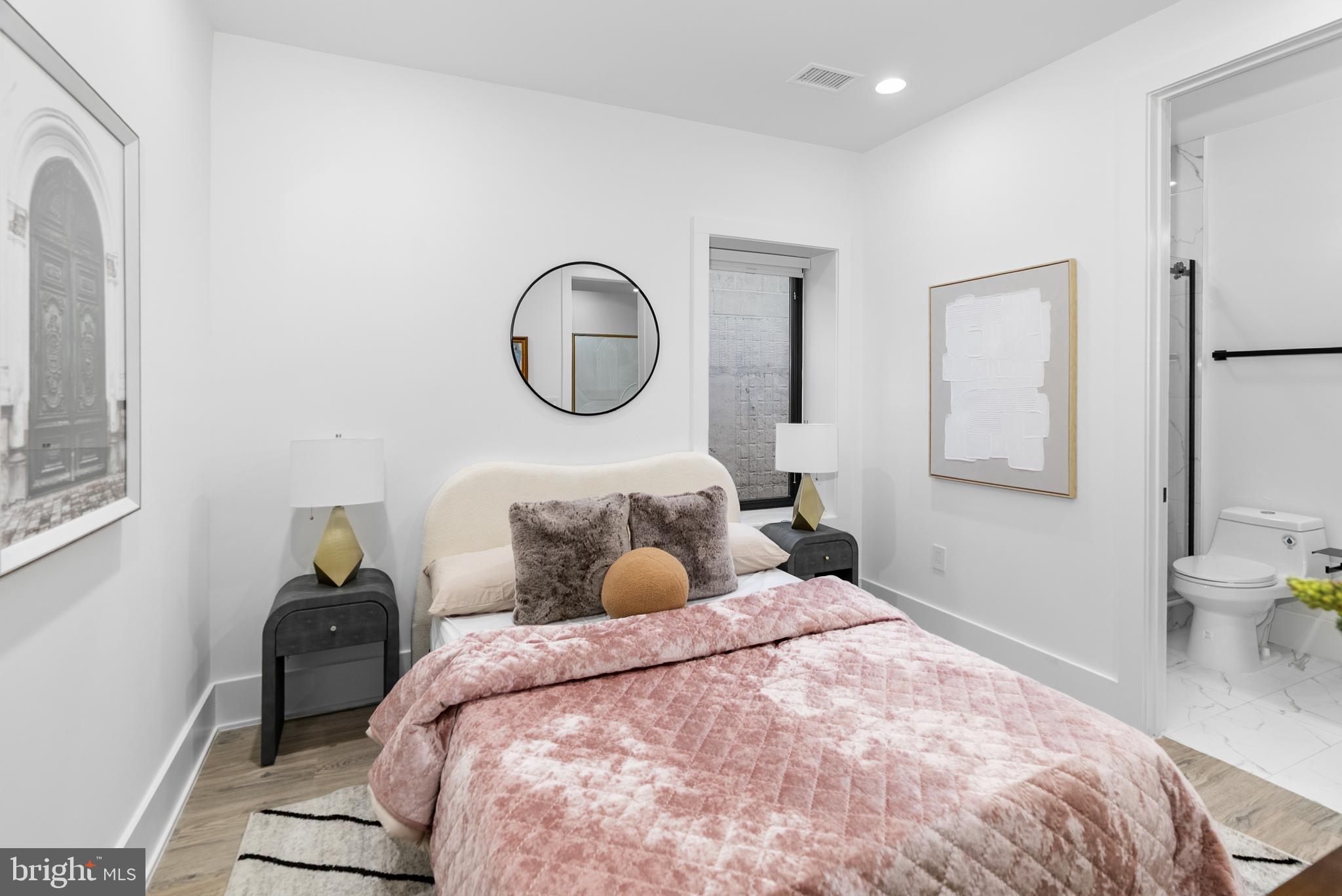 1140 Oates Street Northeast, Unit 101 Washington, DC 20002 - Photo 20 of 34 a bedroom with a bed and a window