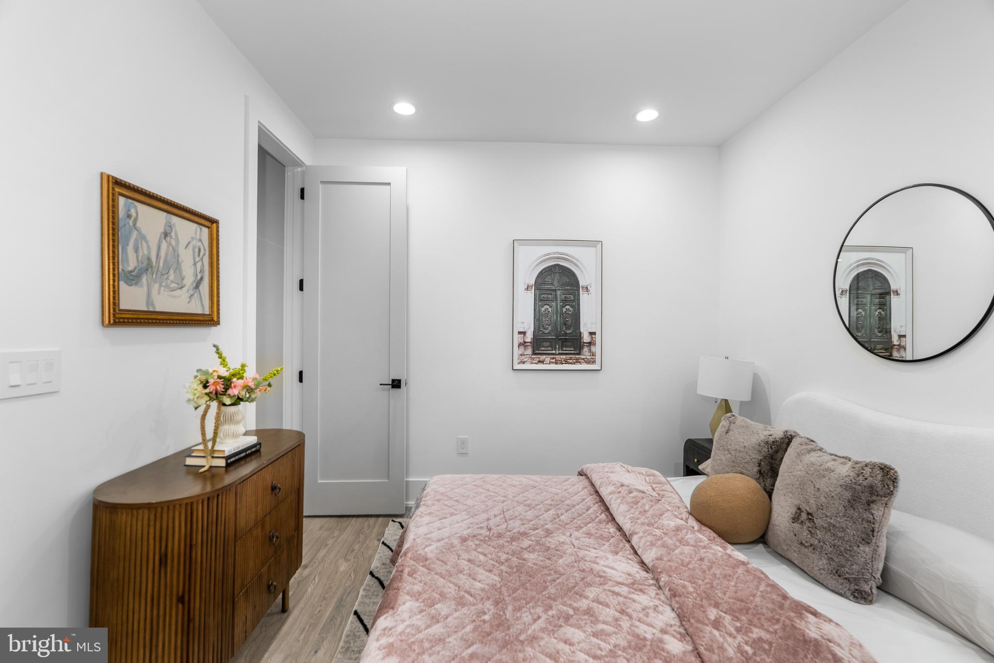 1140 Oates Street Northeast, Unit 101 Washington, DC 20002 - Photo 21 of 34 a bedroom with bed and window