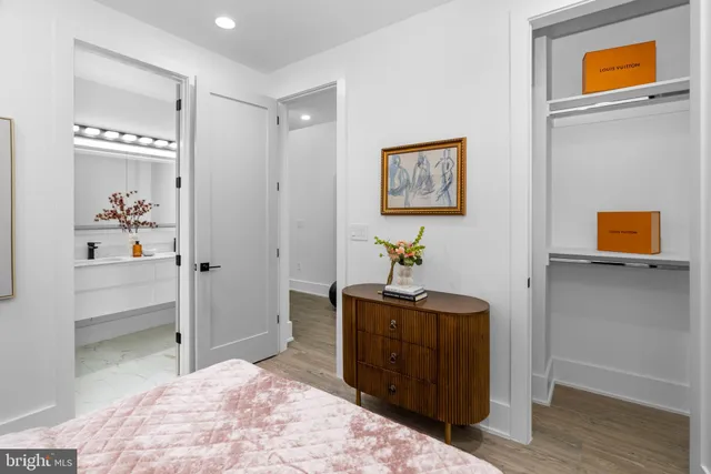 a bedroom with a bed and a dresser