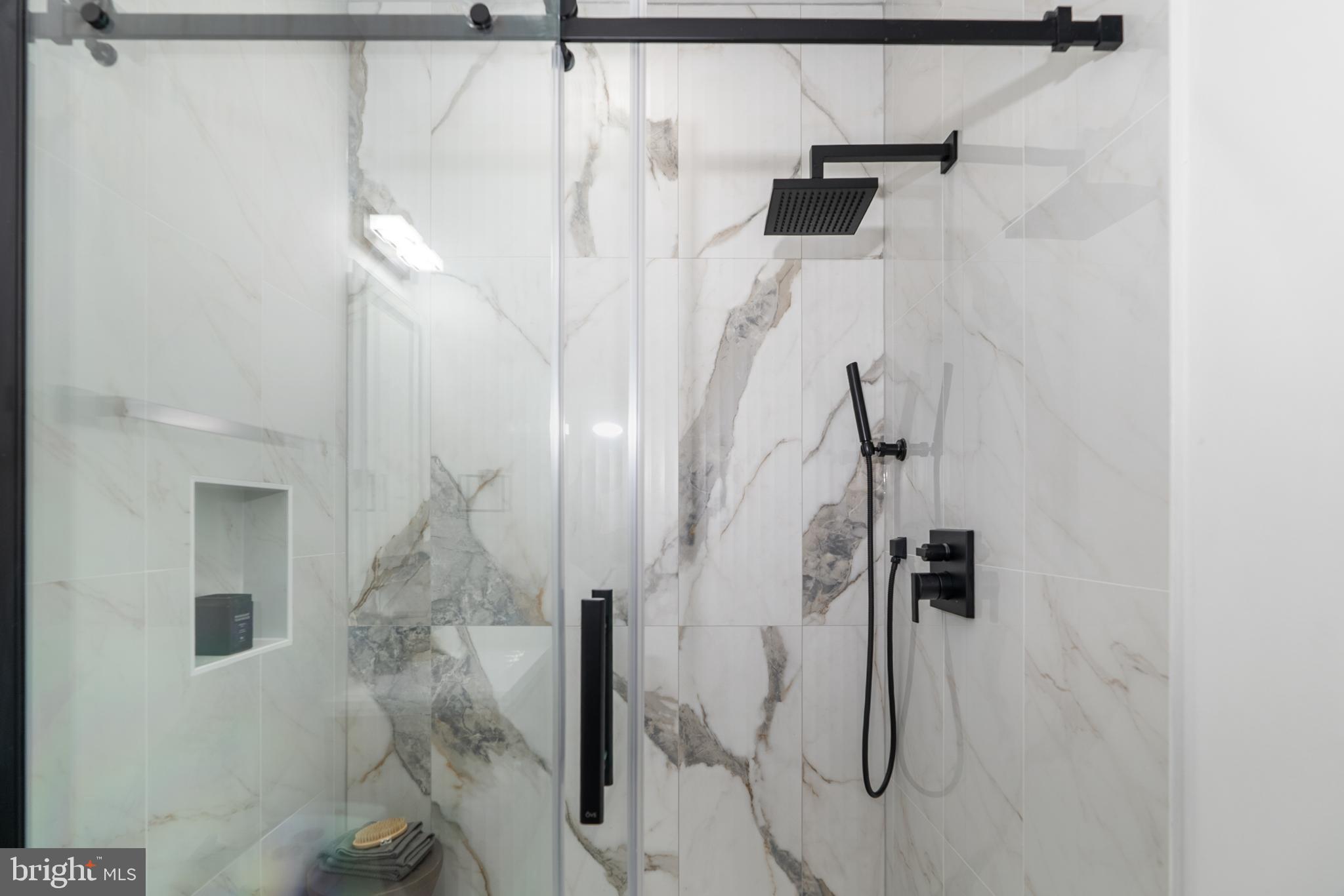 1140 Oates Street Northeast, Unit 101 Washington, DC 20002 - Photo 30 of 34 a bathroom with a shower