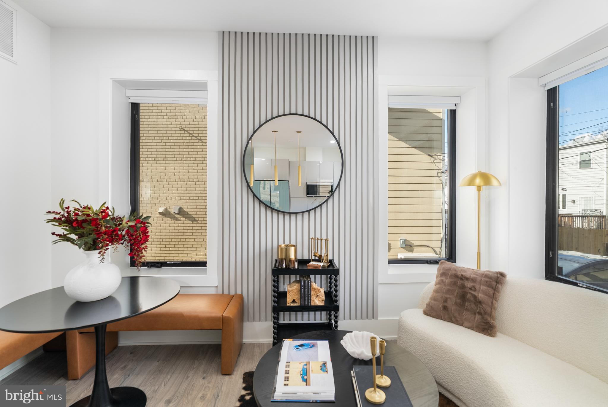 1140 Oates Street Northeast, Unit 101 Washington, DC 20002 - Photo 6 of 34 a living room with furniture and a potted plant