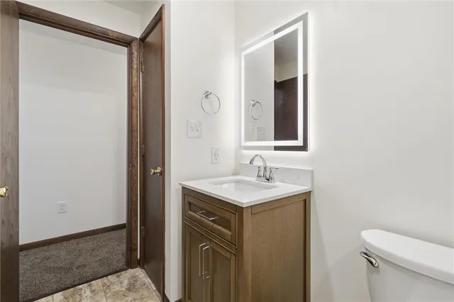 an empty room with a empty space and windows