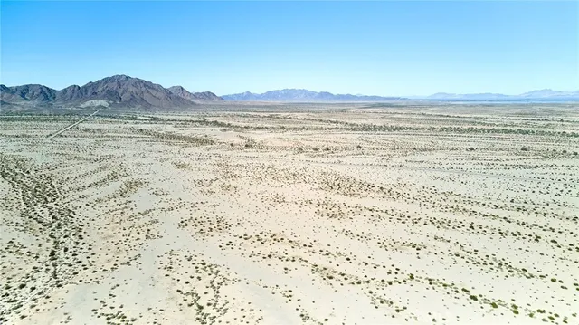 a view of beach and mountain