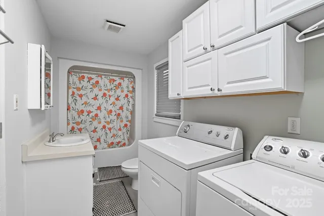 a utility room with dryer and washer