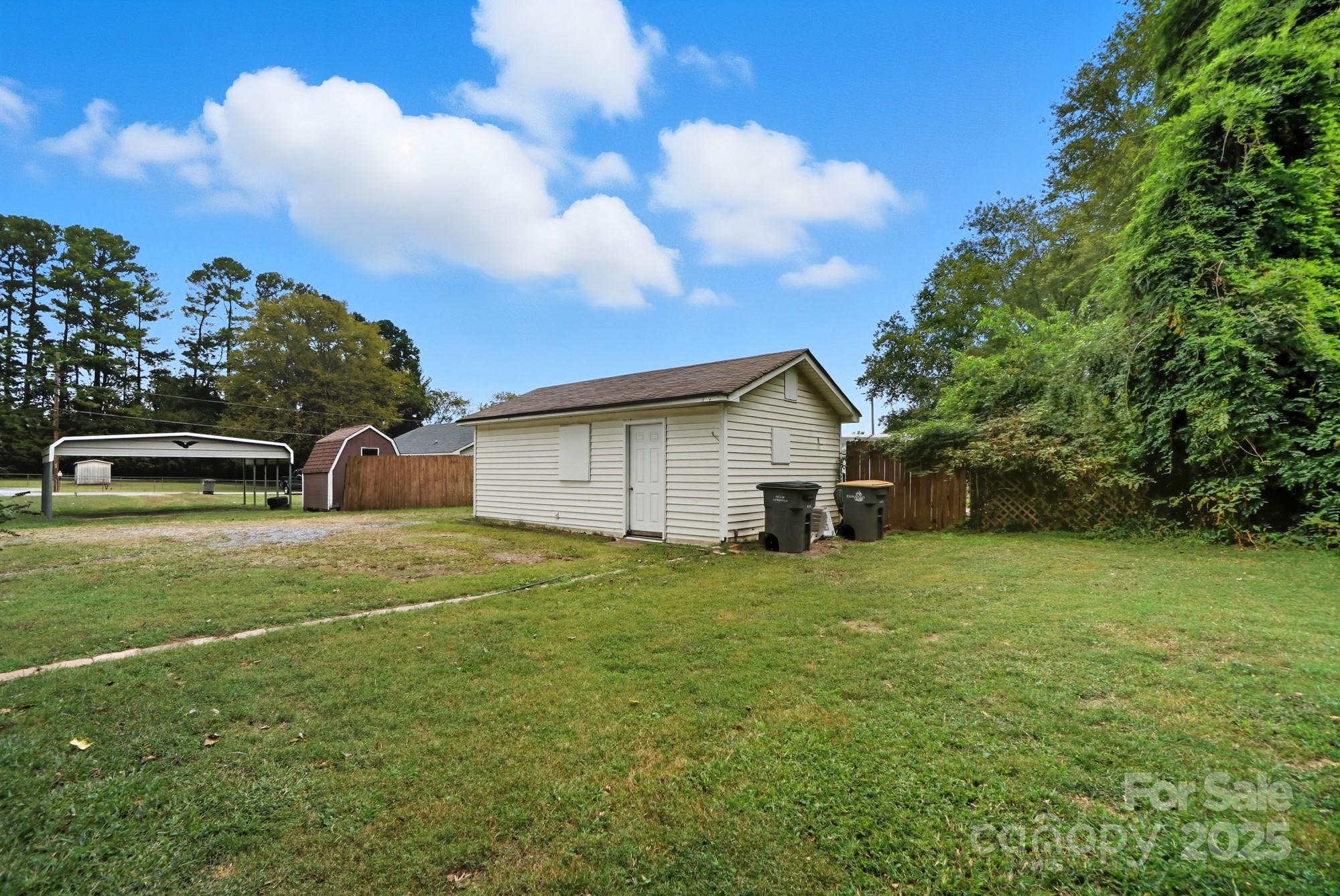 2729 South Ridge Avenue Concord, NC 28025 - Photo 17 of 19 a view of backyard of house with green space