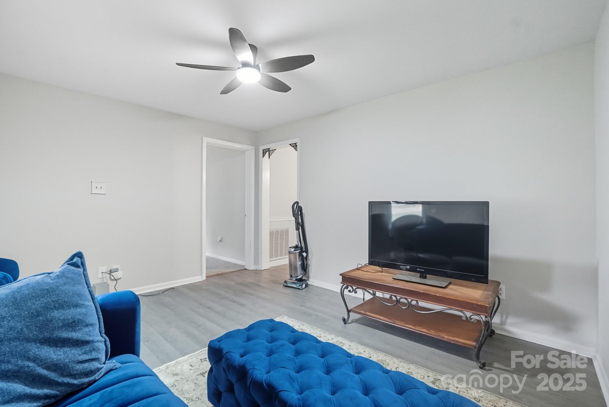 2729 South Ridge Avenue Concord, NC 28025 - Photo 5 of 19 a living room with furniture and a flat screen tv