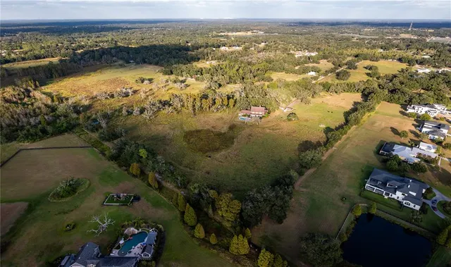 an aerial view of residential building and lake