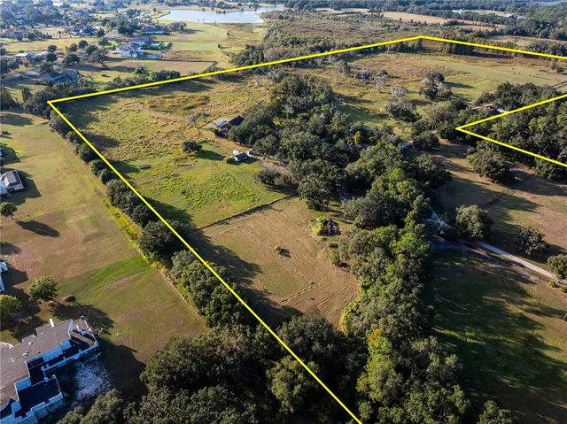 a view of a swimming pool and an outdoor seating
