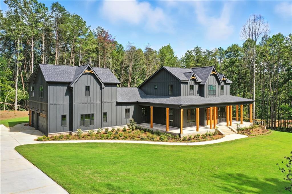 a front view of a house with a yard table and chairs